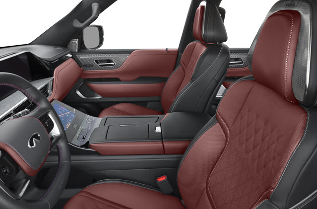 Interior of a luxury 2025 INFINITI QX80 with red leather seats and a modern dashboard.